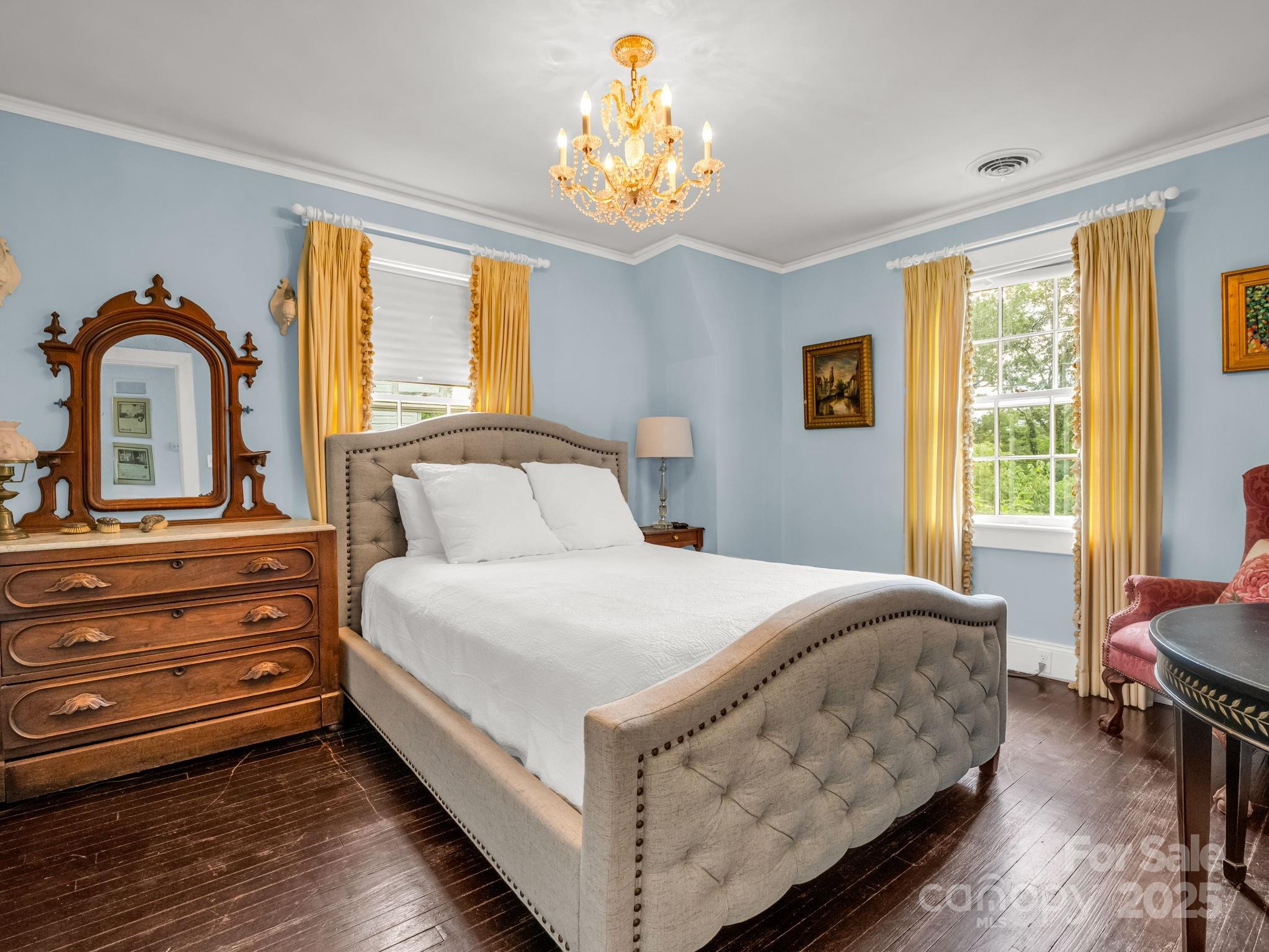 191 West 6th Street Rutherfordton, NC 28139 - Photo 11 of 38 a bedroom with a bed and a large window with wooden floor
