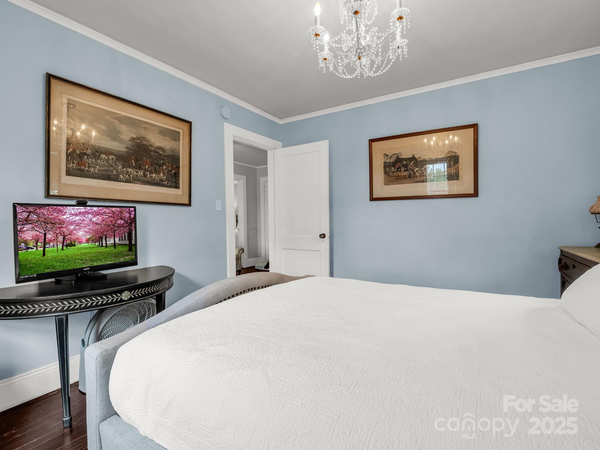 191 West 6th Street Rutherfordton, NC 28139 - Photo 12 of 38 a bedroom with a bed and a flat screen tv