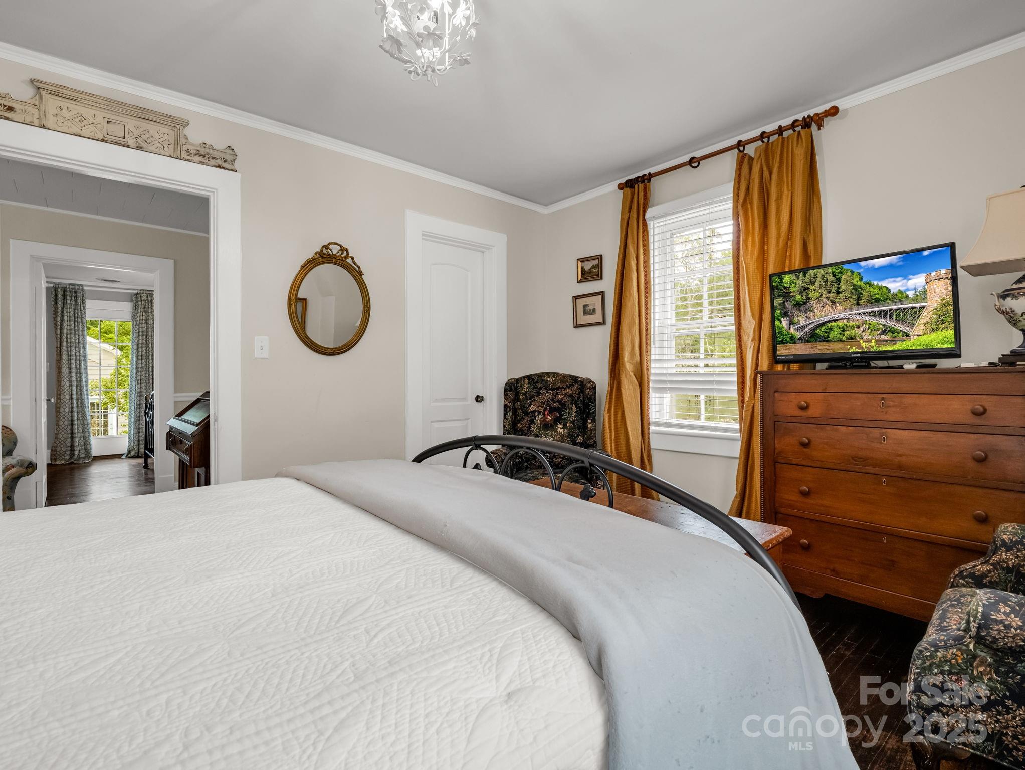 191 West 6th Street Rutherfordton, NC 28139 - Photo 14 of 38 a bedroom with a bed and a flat tv screen on dresser