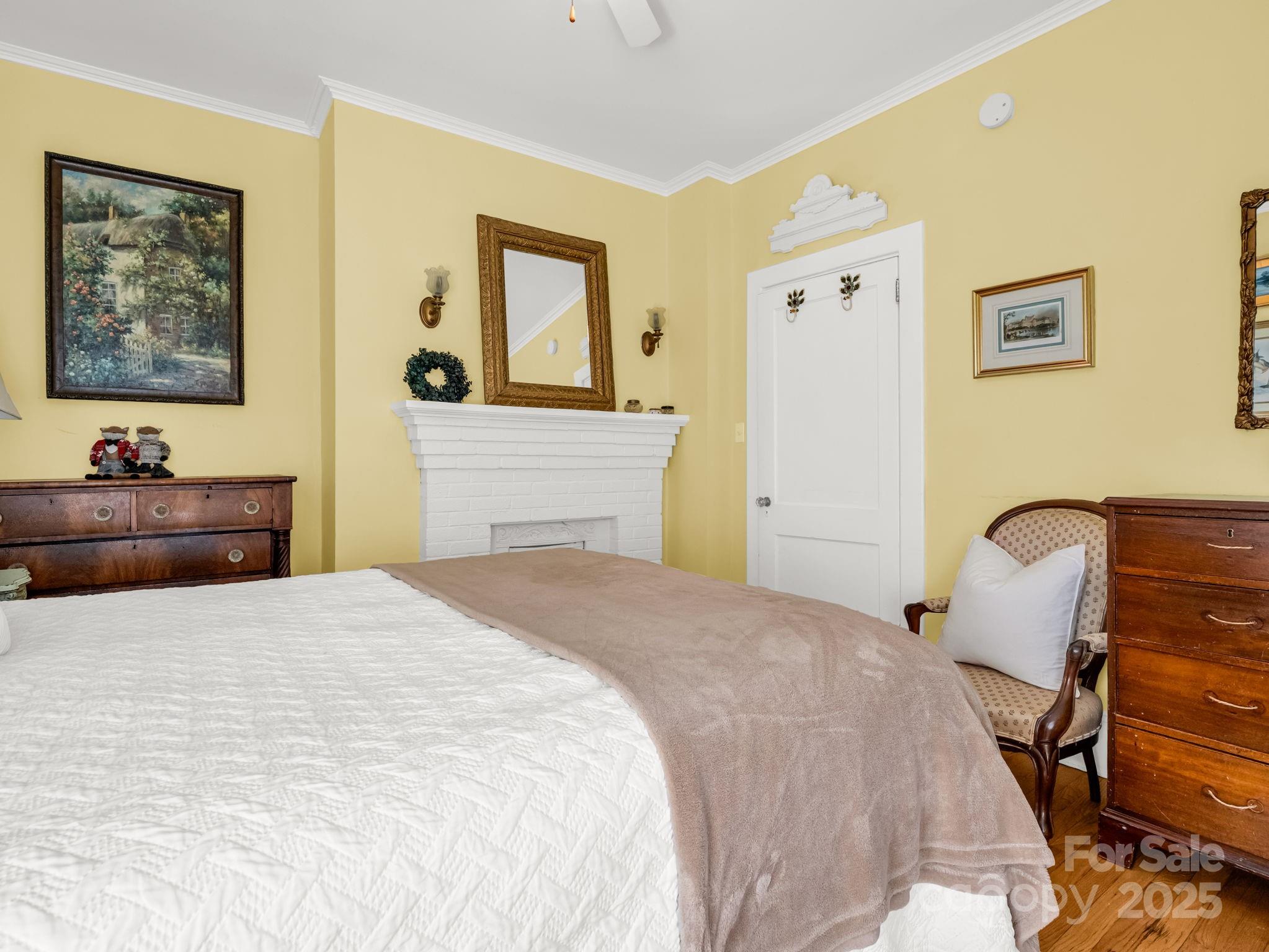 191 West 6th Street Rutherfordton, NC 28139 - Photo 15 of 38 a bedroom with a bed and wooden floor