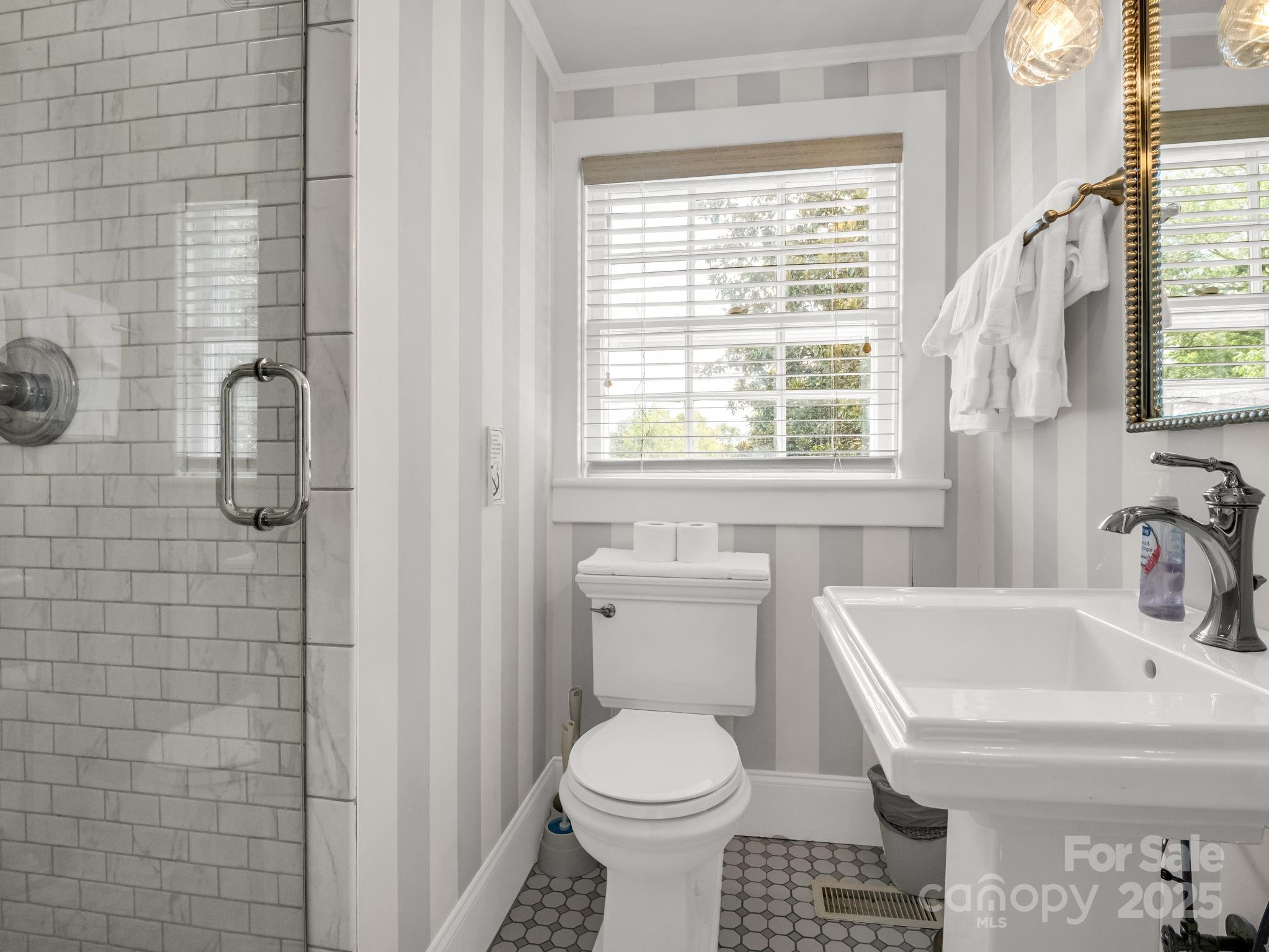 191 West 6th Street Rutherfordton, NC 28139 - Photo 17 of 38 a bathroom with a sink toilet and shower
