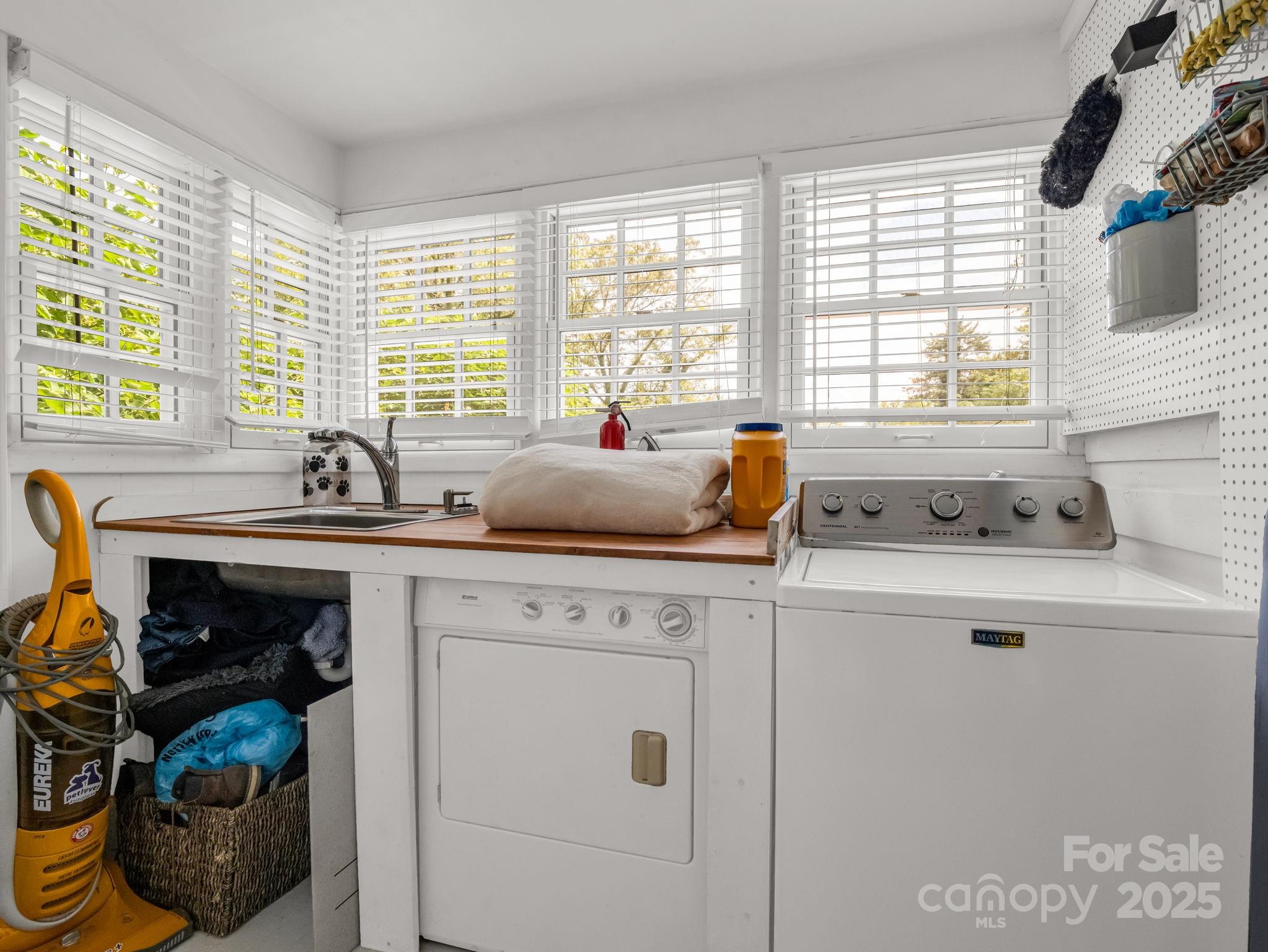 191 West 6th Street Rutherfordton, NC 28139 - Photo 19 of 38 a kitchen with sink a window and cabinets