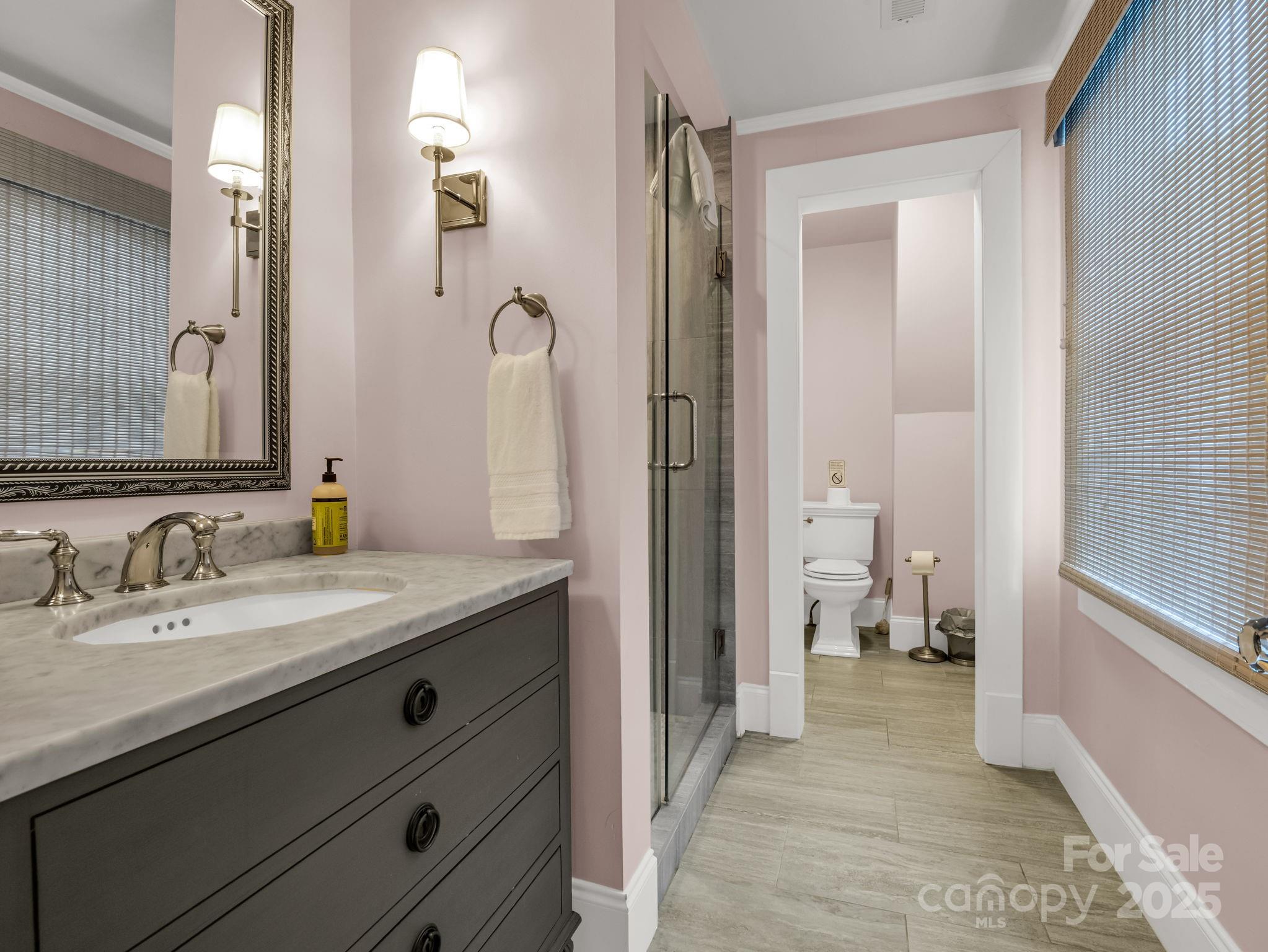 191 West 6th Street Rutherfordton, NC 28139 - Photo 24 of 38 a en suite bathroom with a granite countertop sink and a mirror
