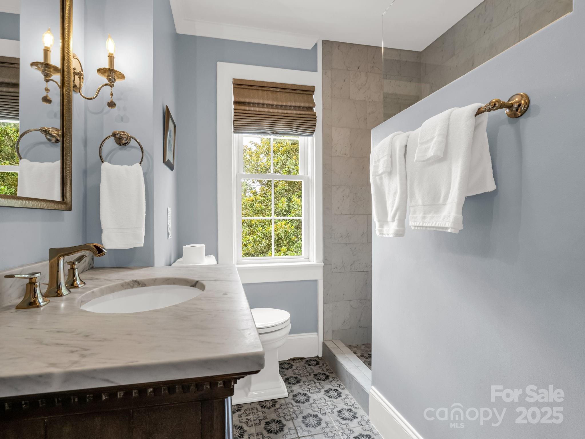 191 West 6th Street Rutherfordton, NC 28139 - Photo 25 of 38 a bathroom with a sink and a mirror