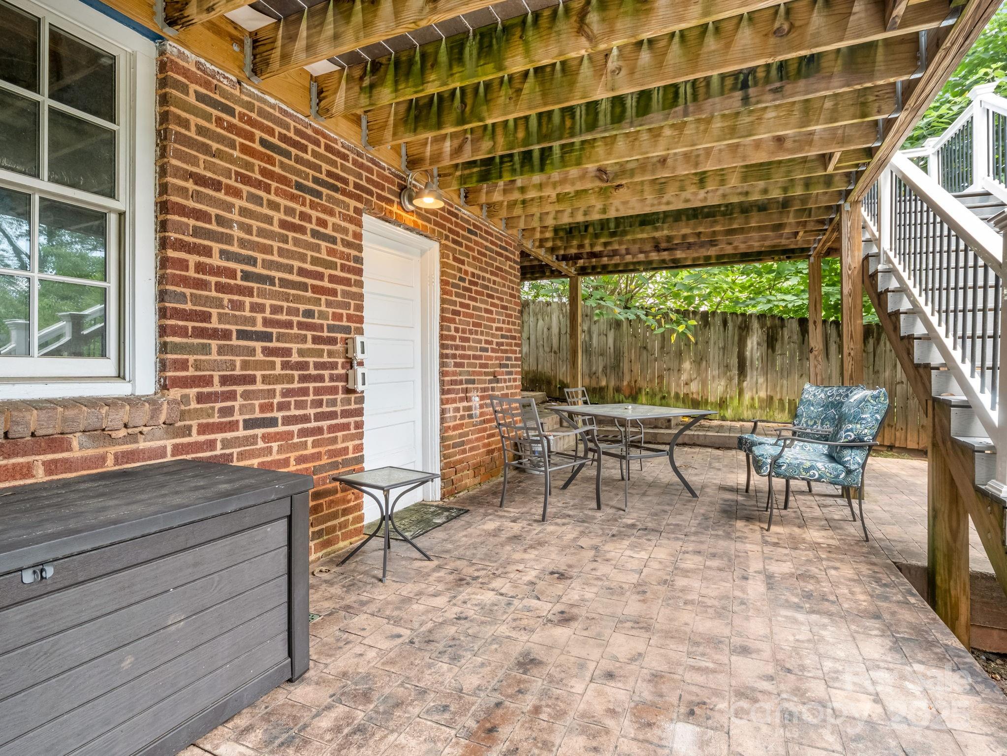 191 West 6th Street Rutherfordton, NC 28139 - Photo 34 of 38 a backyard of a house with table and chairs