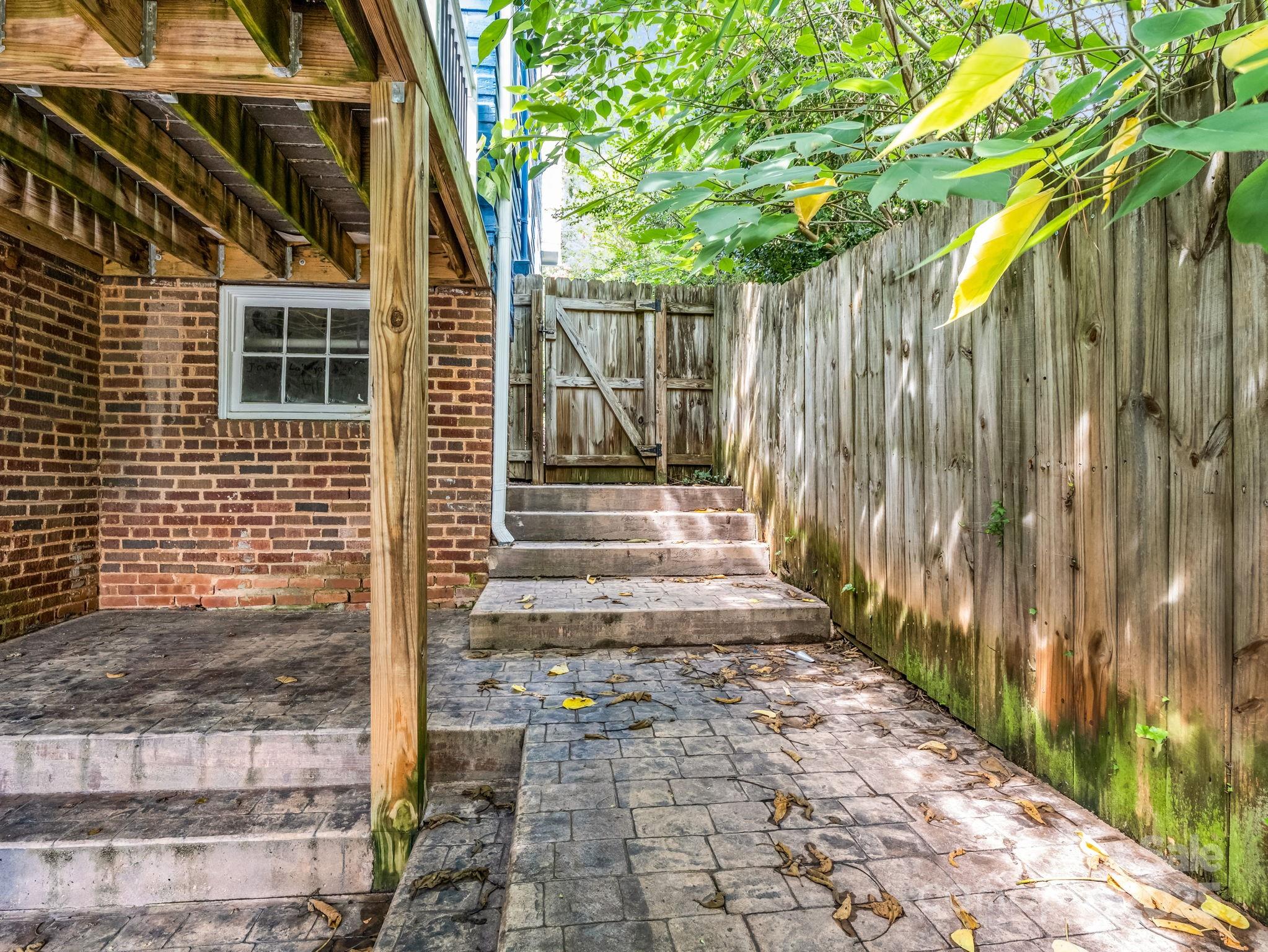 191 West 6th Street Rutherfordton, NC 28139 - Photo 36 of 38 a view of a pathway of a house with a iron stairs