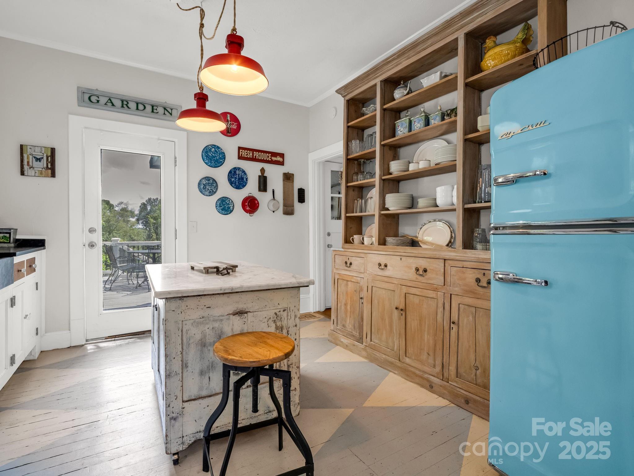 191 West 6th Street Rutherfordton, NC 28139 - Photo 6 of 38 a kitchen with stainless steel appliances cabinets and wooden floor