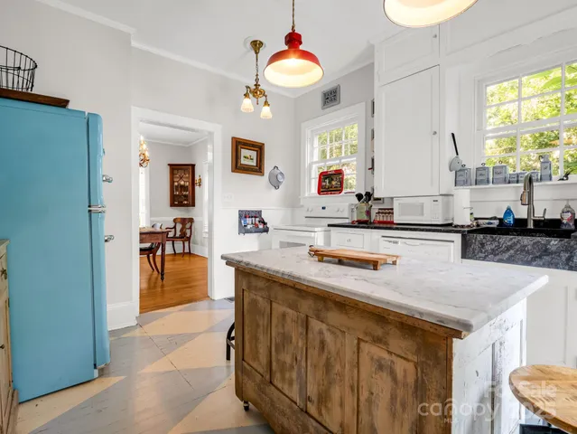 a kitchen with counter top space a sink and cabinets
