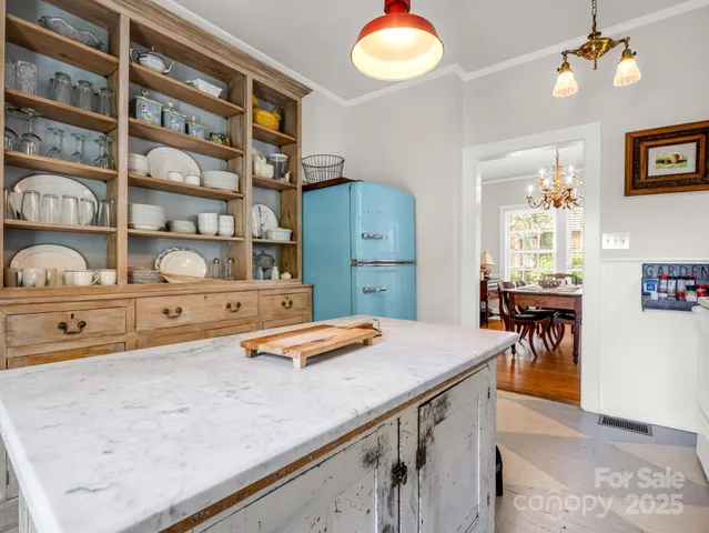 a room with cabinets and wooden floor