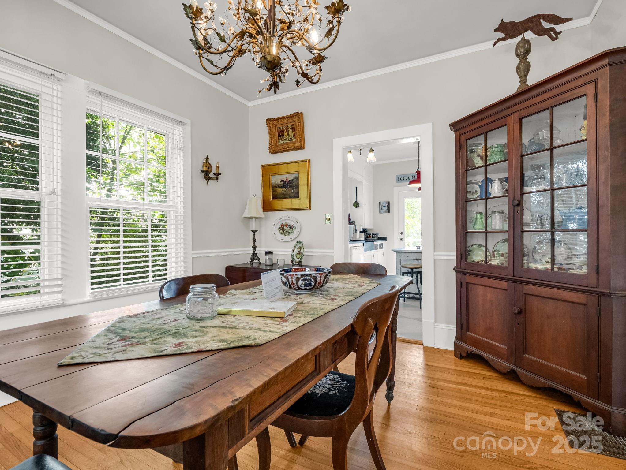 191 West 6th Street Rutherfordton, NC 28139 - Photo 10 of 38 a kitchen with granite countertop a stove a sink dishwasher and wooden cabinets with wooden floor