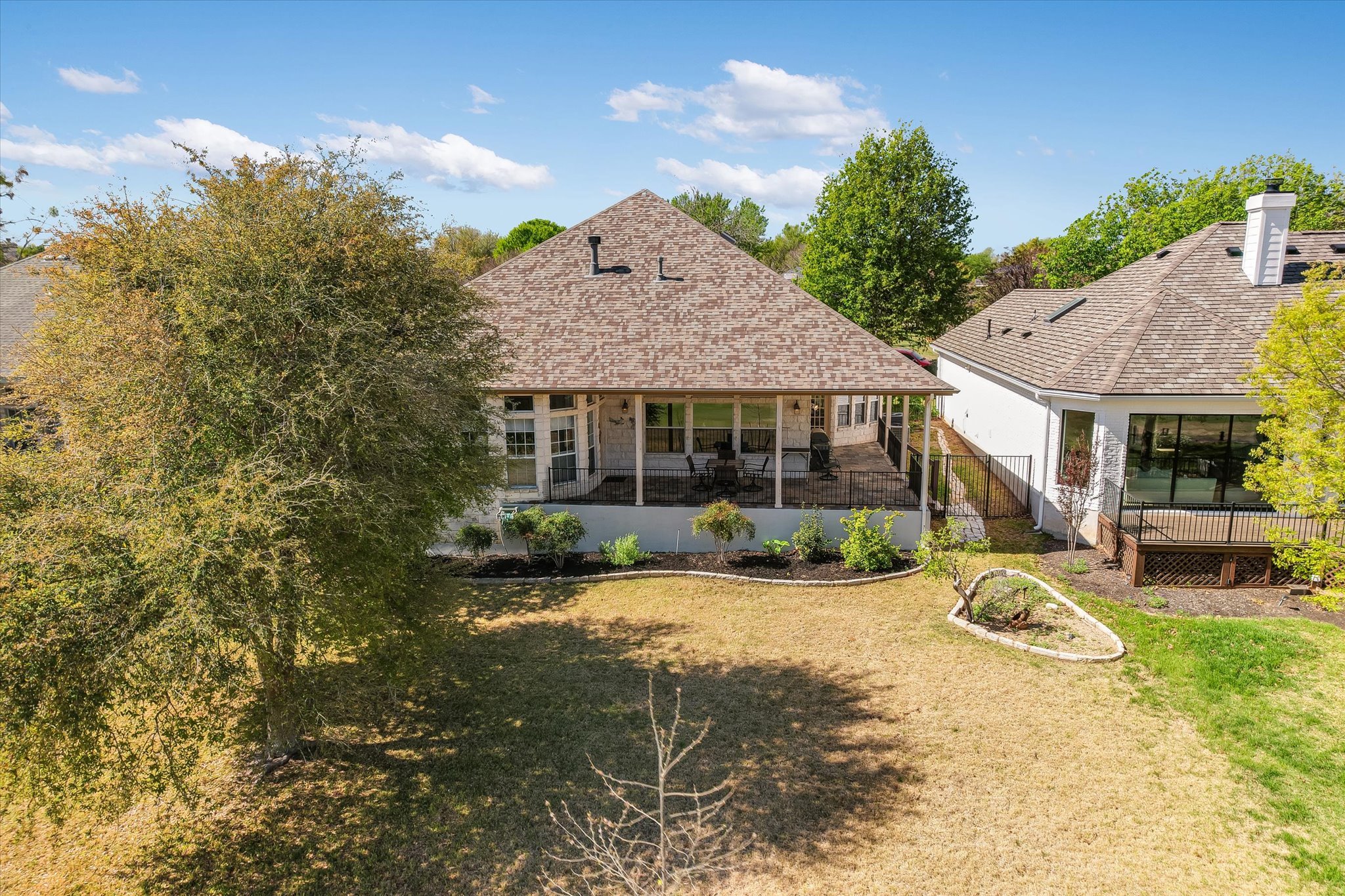 4912 Interlachen Lane Austin, TX 78747 - Photo 30 of 39 a view of a house with backyard porch and sitting area
