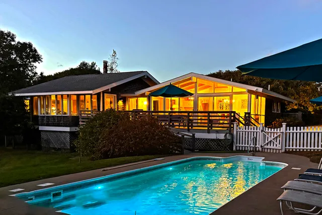 a view of swimming pool with an outdoor seating