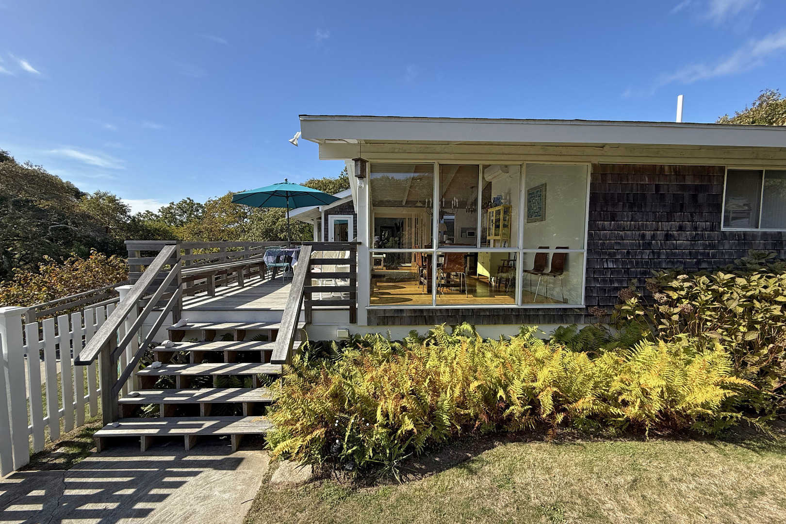 6 Trail End Chilmark, MA 02535 - Photo 3 of 16 a front view of a house with a yard