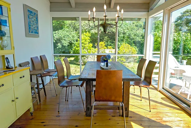 a view of a dining room with furniture window and outside view