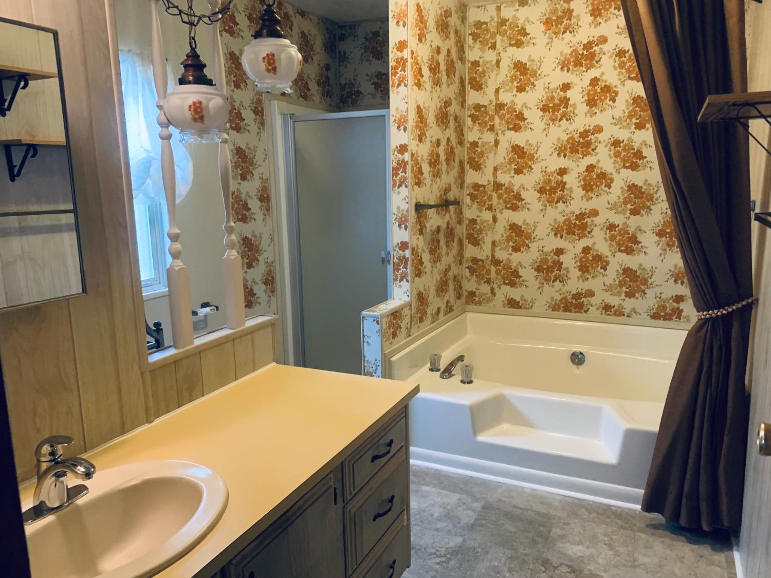 3901 Lake Road, Unit 72 West Sacramento, CA 95691 - Photo 37 of 53 a bathroom with a tub sink and mirror