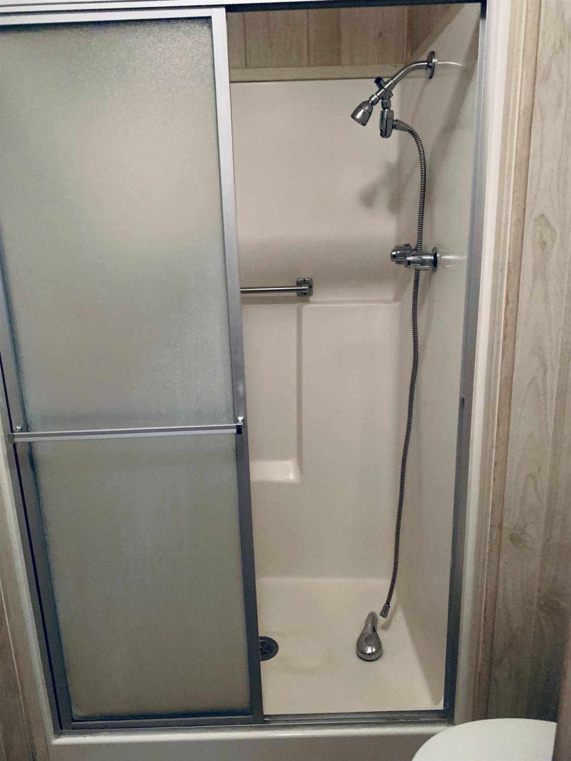 3901 Lake Road, Unit 72 West Sacramento, CA 95691 - Photo 47 of 53 a bathroom with a glass shower door