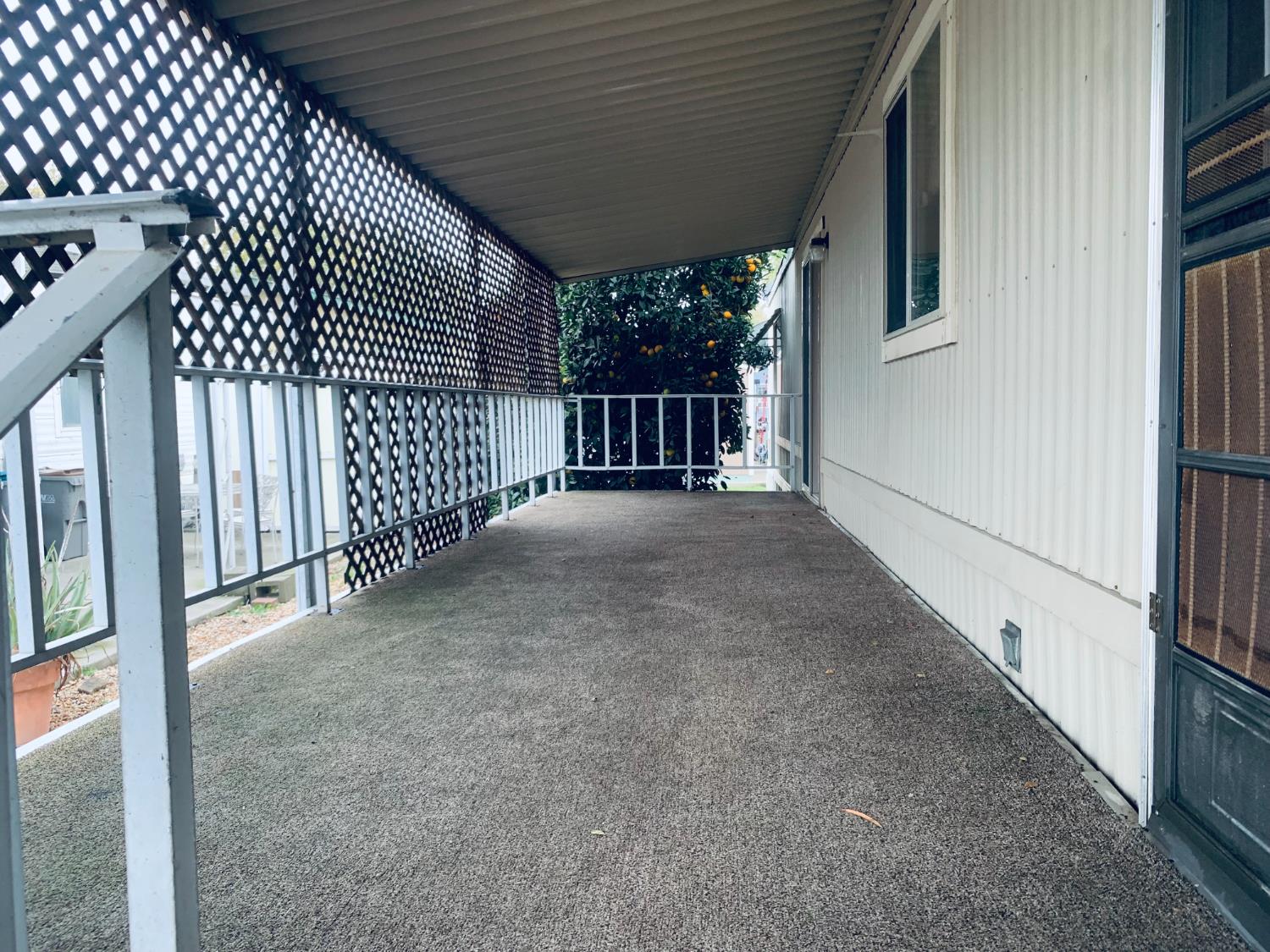3901 Lake Road, Unit 72 West Sacramento, CA 95691 - Photo 6 of 53 a view of a porch with wooden floor