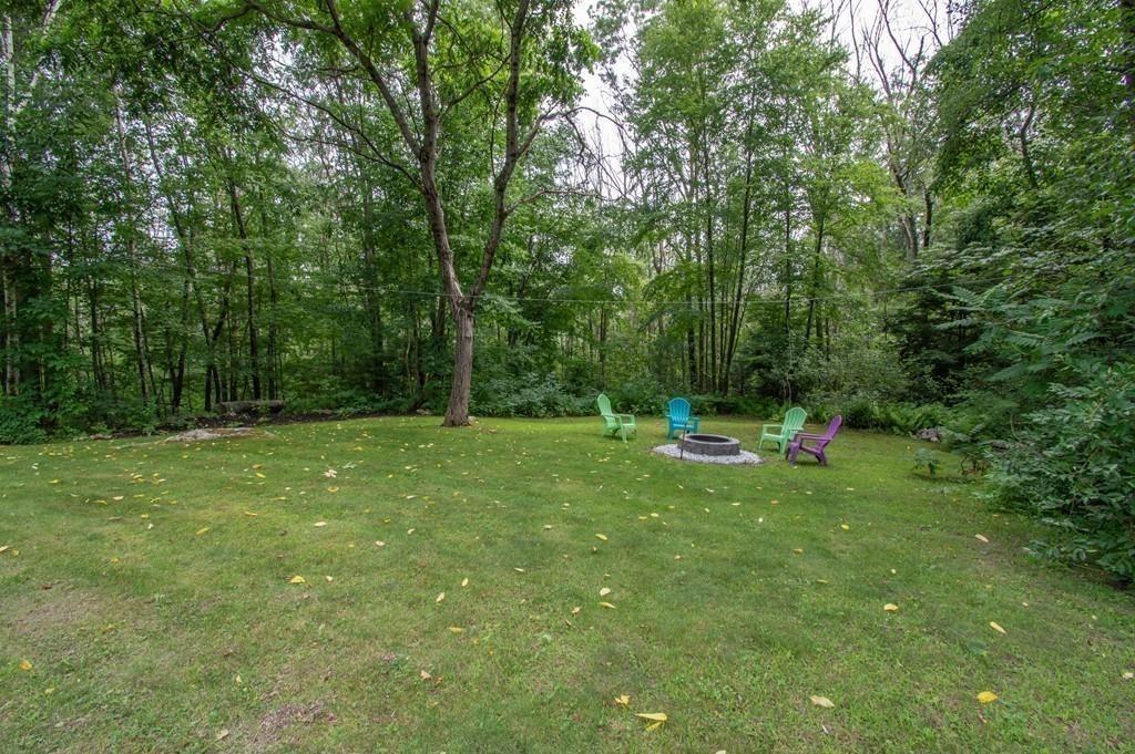 40 Paradise Lake Road Monson, MA 01057 - Photo 11 of 15 a view of a backyard with a small cabin