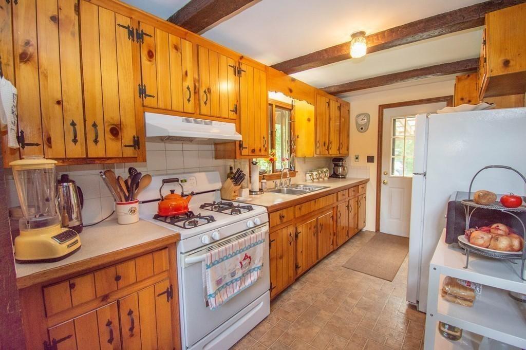 40 Paradise Lake Road Monson, MA 01057 - Photo 3 of 15 a kitchen with stainless steel appliances granite countertop a sink stove and cabinets