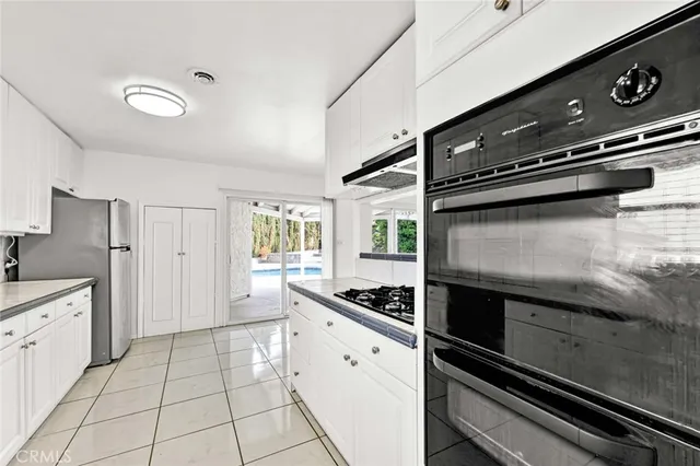 a kitchen with a stove and a microwave