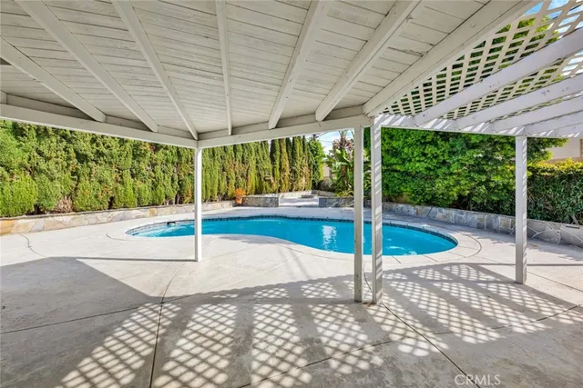 a view of a patio with a table and chairs