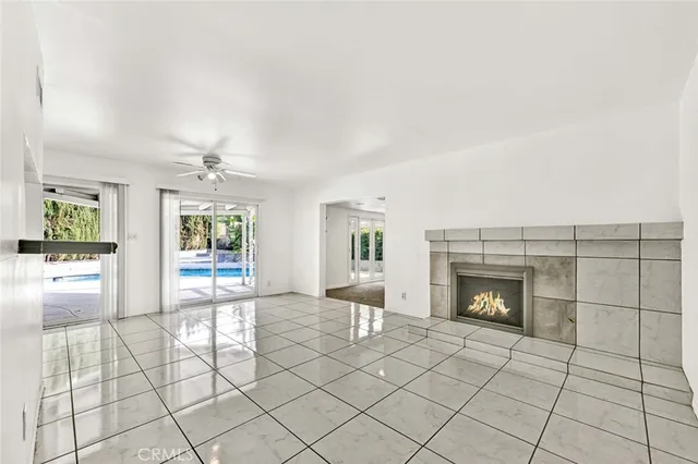 a view of an empty room and fire place
