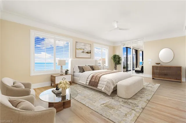 a bedroom with a bed and couch