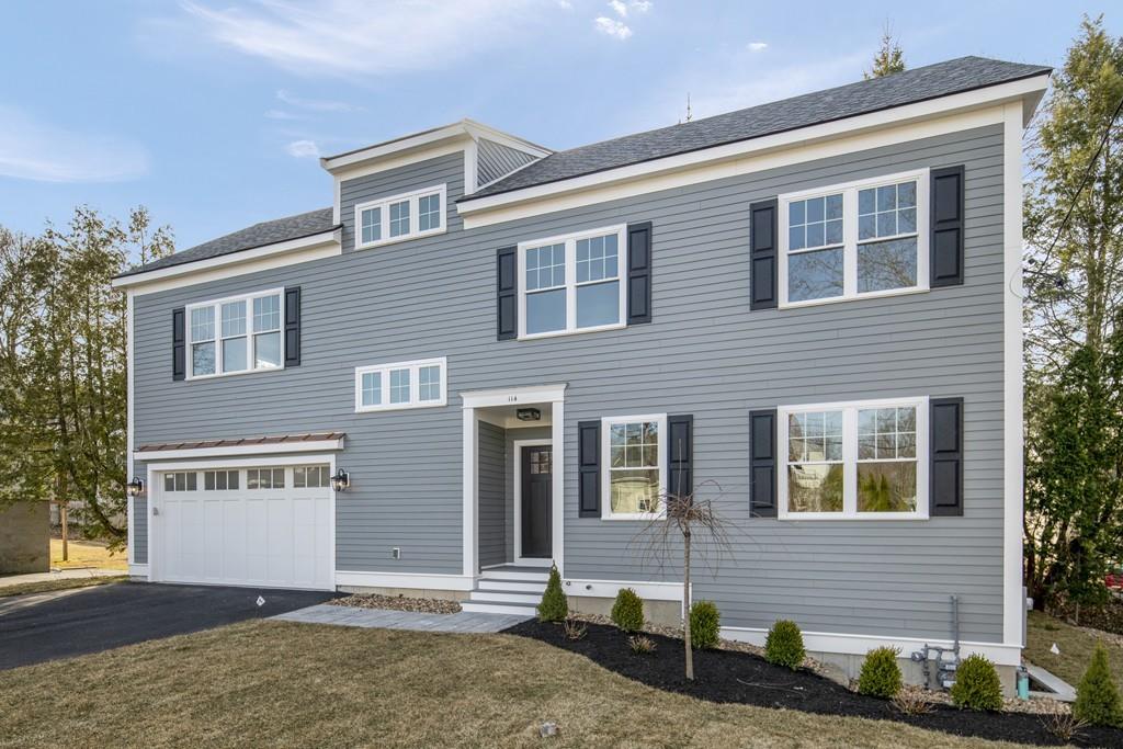 114 Bow Street Lexington, MA 02420 - Photo 1 of 34 a front view of a house with a yard