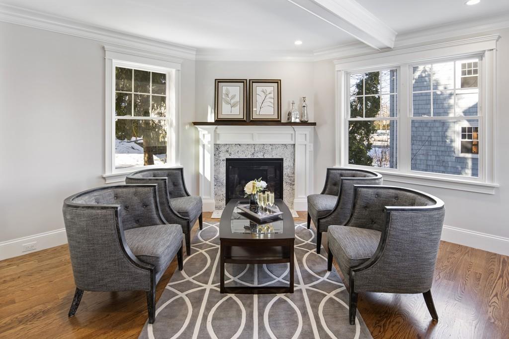 114 Bow Street Lexington, MA 02420 - Photo 12 of 34 a living room with furniture and a fireplace