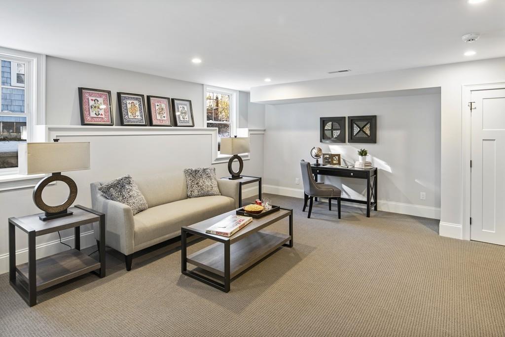 114 Bow Street Lexington, MA 02420 - Photo 15 of 34 a living room with furniture and a wall painting