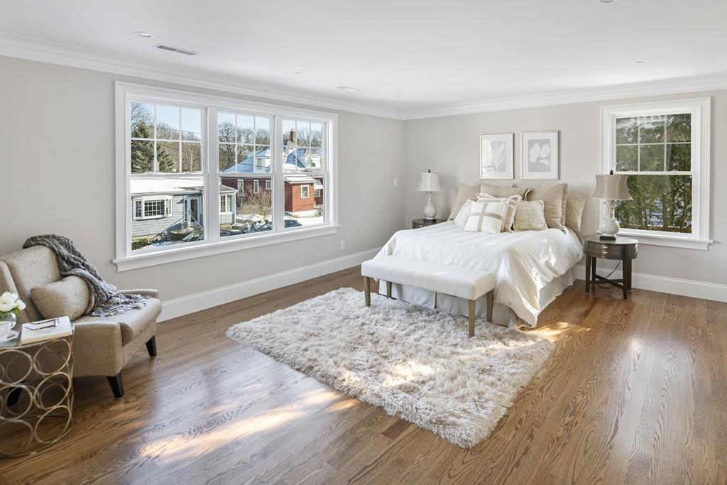 114 Bow Street Lexington, MA 02420 - Photo 18 of 34 a bed room with a bed and wooden floor