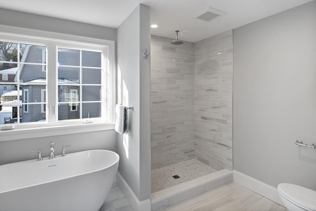 114 Bow Street Lexington, MA 02420 - Photo 21 of 34 a bathroom with a bathtub and a shower
