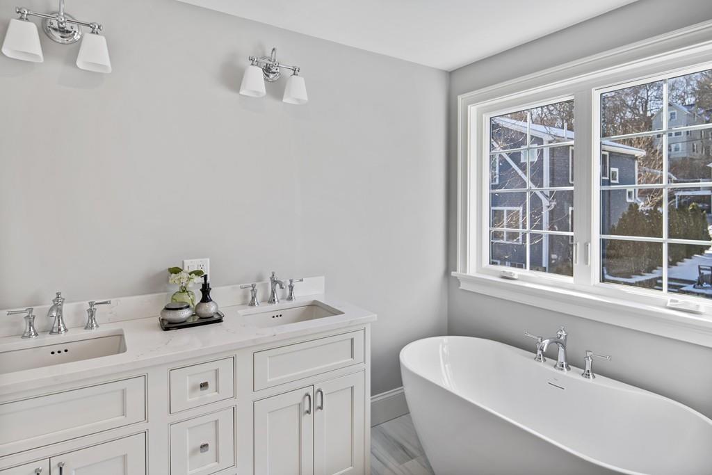 114 Bow Street Lexington, MA 02420 - Photo 22 of 34 a bathroom with a sink and a bathtub