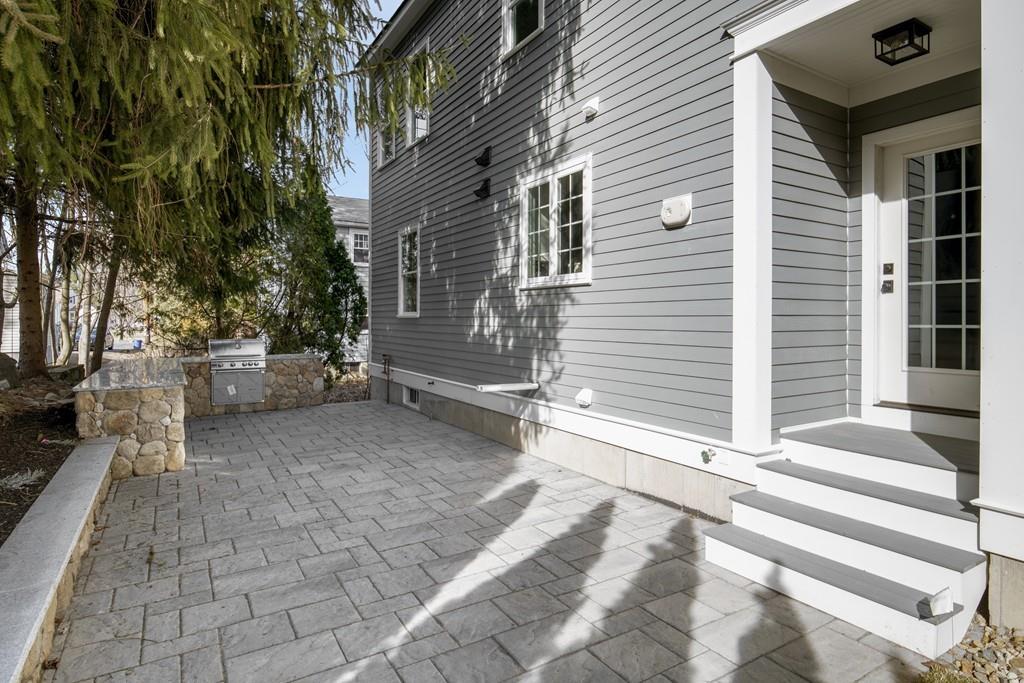 114 Bow Street Lexington, MA 02420 - Photo 30 of 34 a view of a back yard of the house