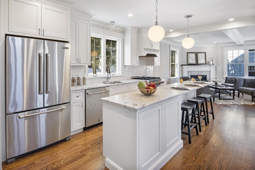 114 Bow Street Lexington, MA 02420 - Photo 3 of 34 a kitchen with a sink a refrigerator and wooden floor