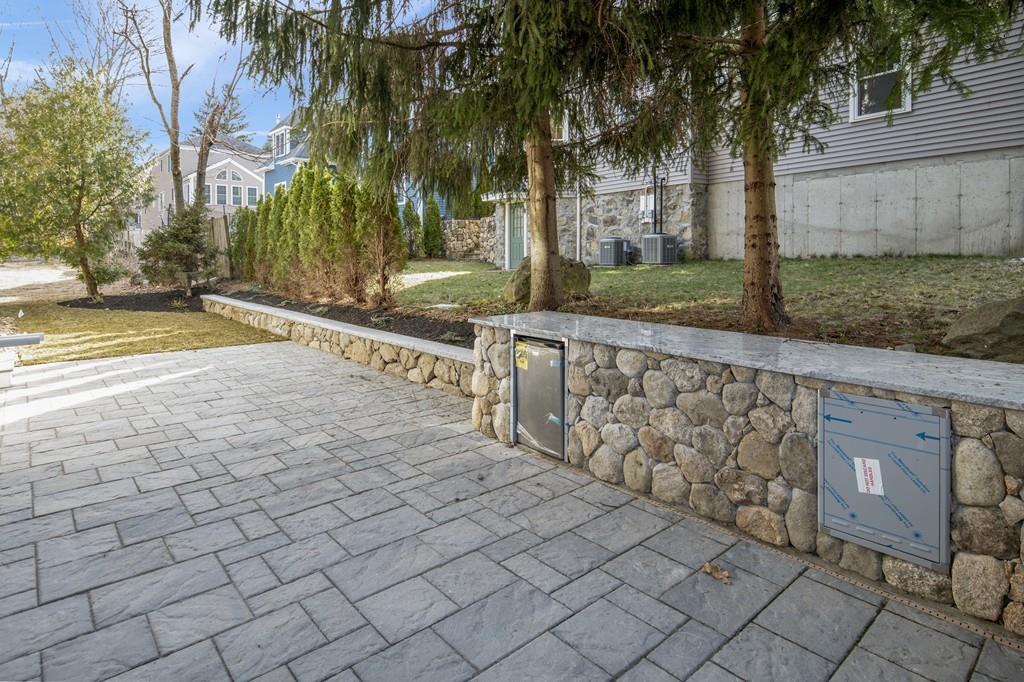 114 Bow Street Lexington, MA 02420 - Photo 33 of 34 a view of a backyard with trees