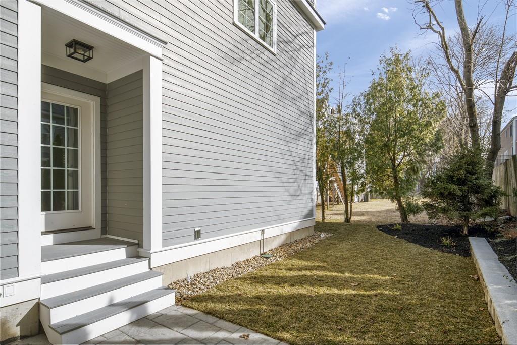 114 Bow Street Lexington, MA 02420 - Photo 34 of 34 a view of a house with a yard