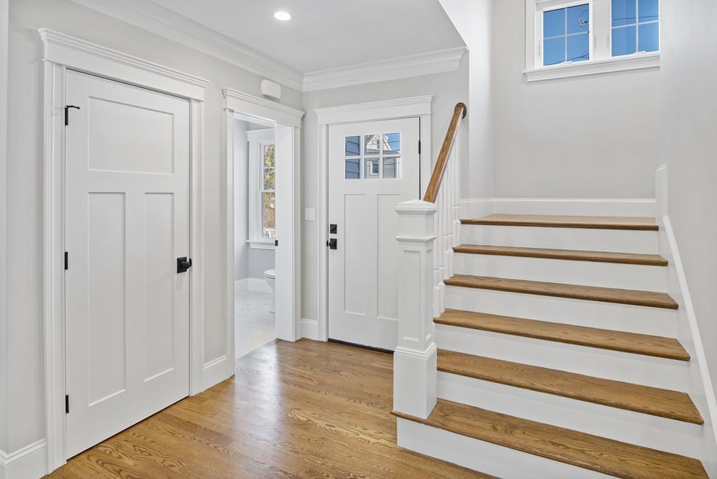 114 Bow Street Lexington, MA 02420 - Photo 8 of 34 a view of entryway with wooden floor and stairs