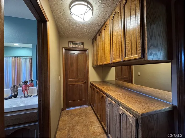 a kitchen with stainless steel appliances granite countertop cabinets and wooden floor