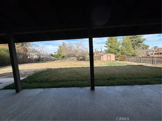 a view of a yard with porch and mountain view