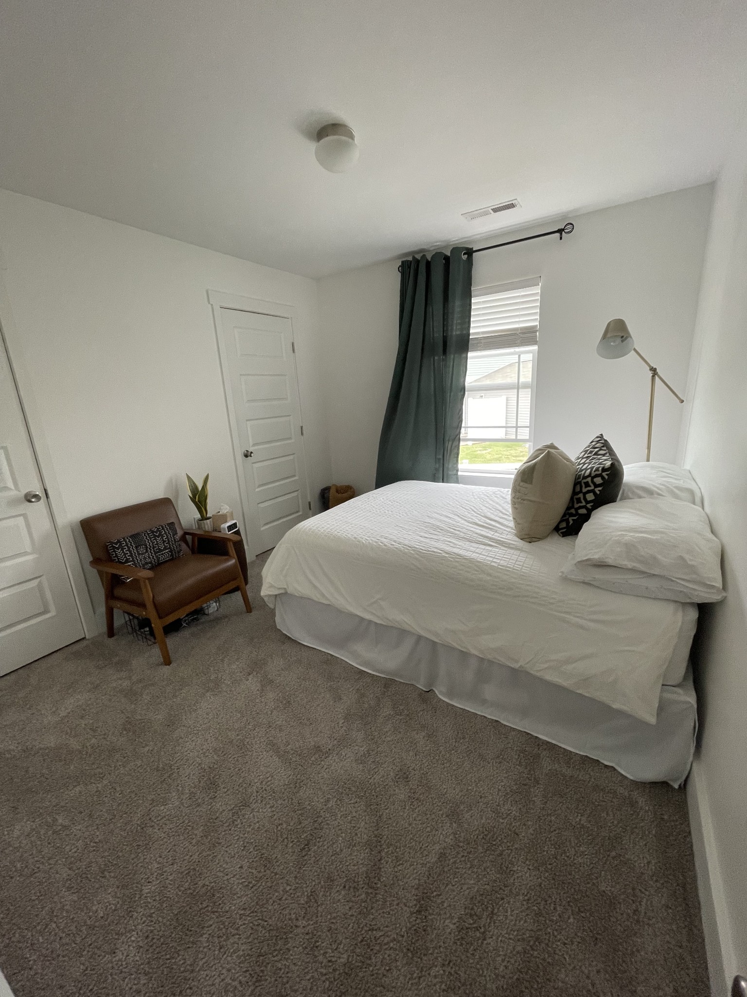 6052 Hillside Lane Spring Hill, TN 37174 - Photo 11 of 23 a bedroom with a bed and a window