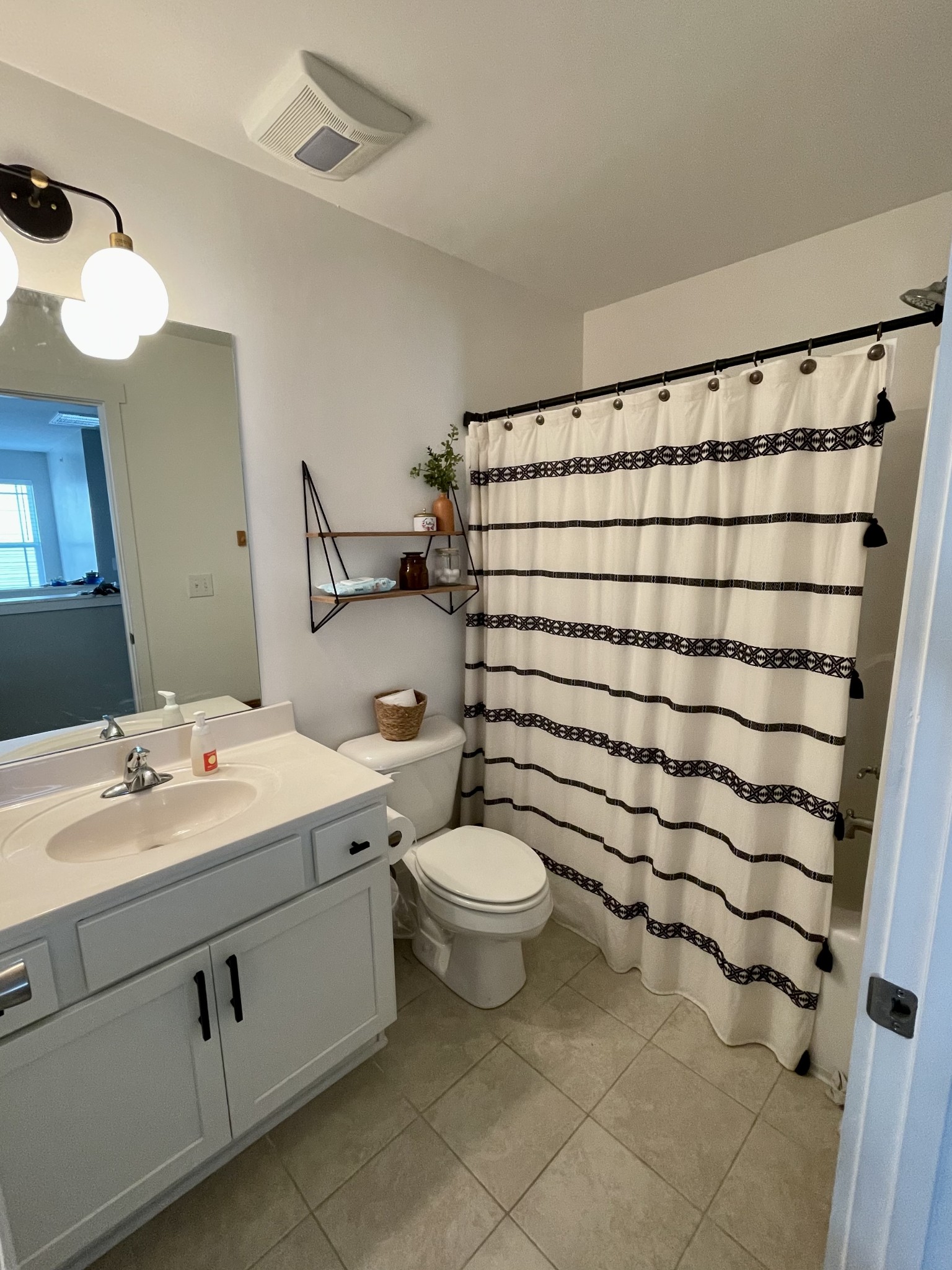 6052 Hillside Lane Spring Hill, TN 37174 - Photo 13 of 23 a bathroom with a sink toilet and shower