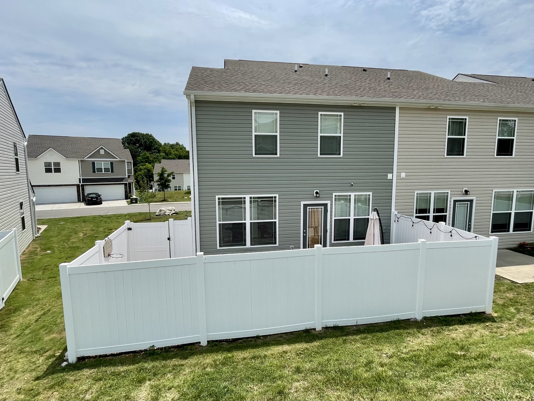 6052 Hillside Lane Spring Hill, TN 37174 - Photo 16 of 23 a view of a house with pool and a yard