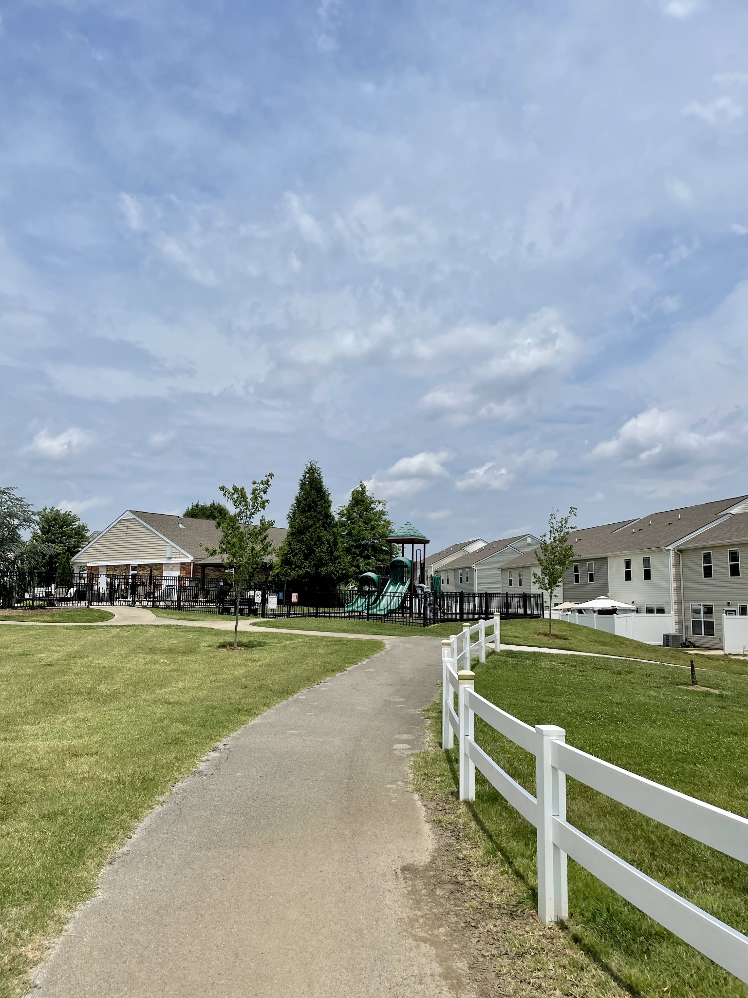 6052 Hillside Lane Spring Hill, TN 37174 - Photo 17 of 23 a view of a swimming pool and a yard in front of the house