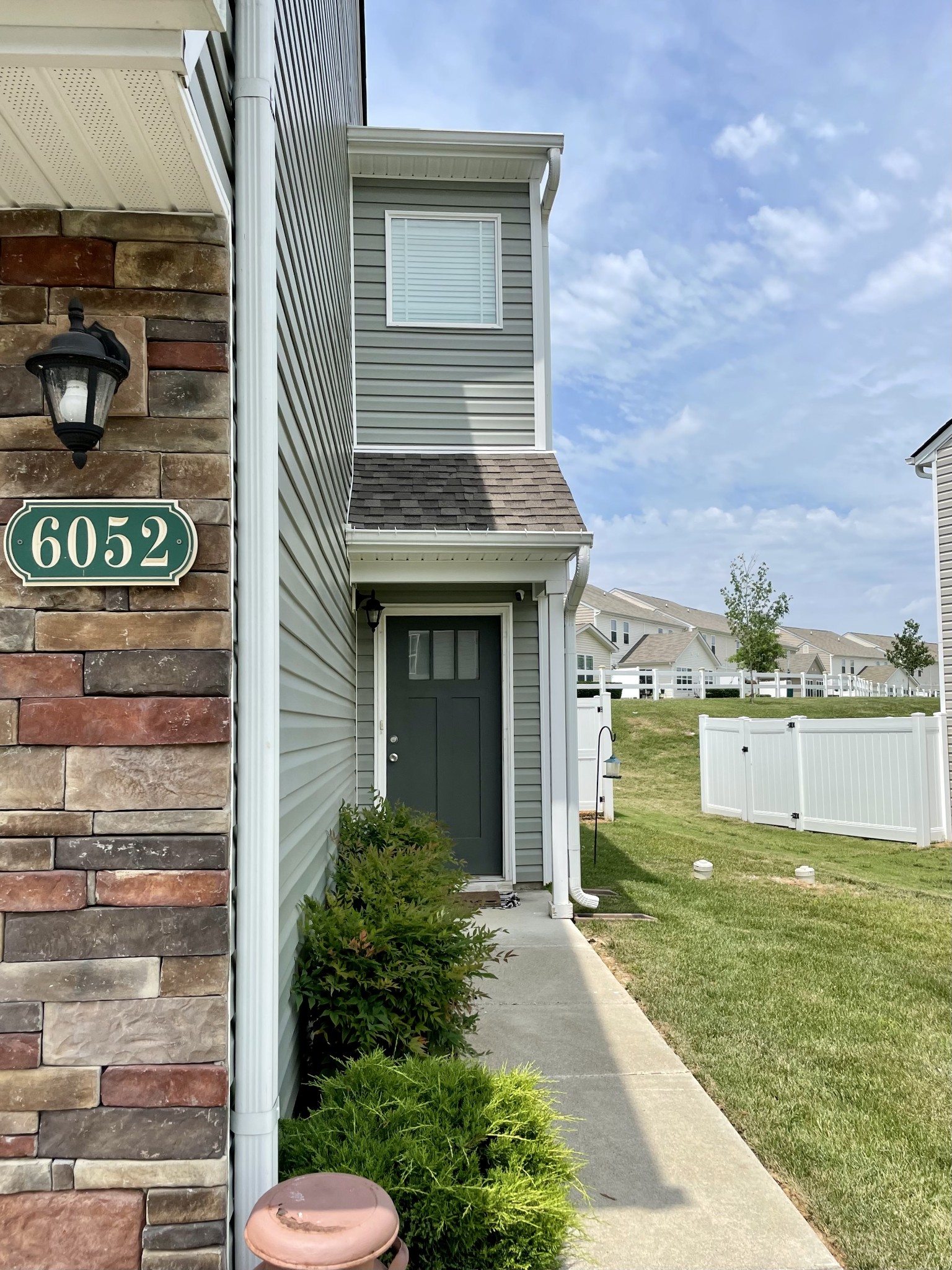 6052 Hillside Lane Spring Hill, TN 37174 - Photo 3 of 23 a view of a house with a yard
