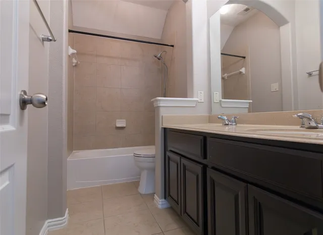 a bathroom with a sink vanity and a mirror