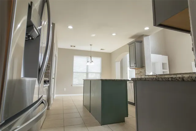 a view of a kitchen with a stove cabinets and a kitchen