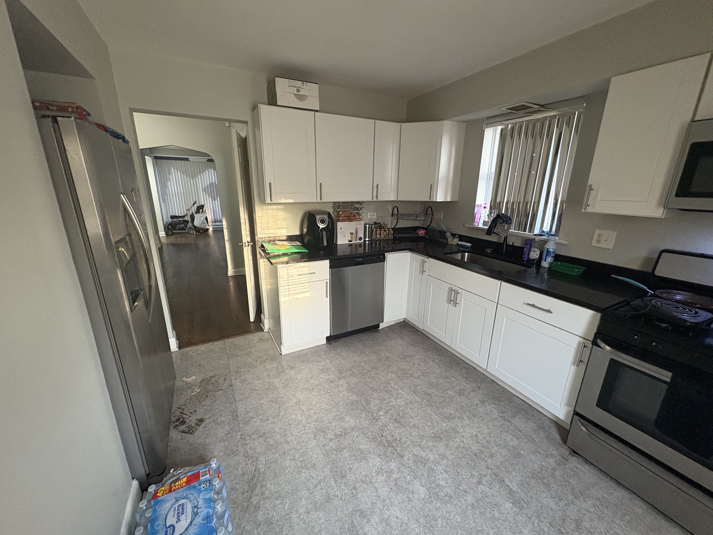 8118 South Spaulding Avenue Chicago, IL 60652 - Photo 2 of 13 a kitchen with a sink stainless steel appliances and cabinets