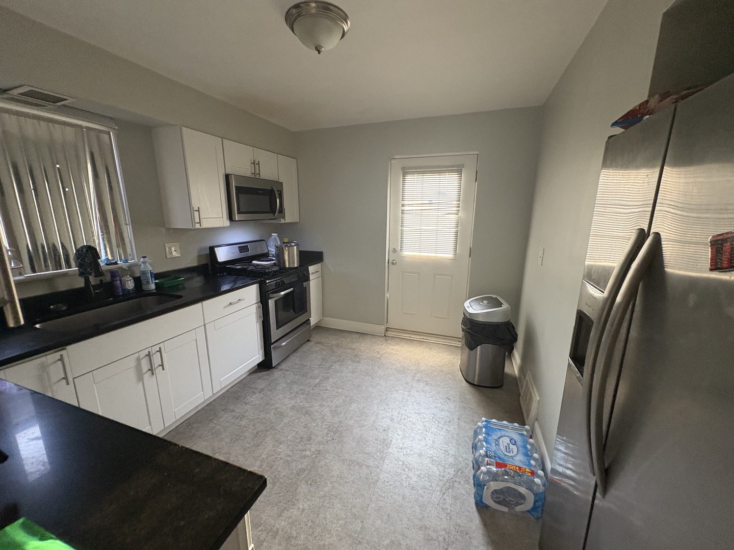 8118 South Spaulding Avenue Chicago, IL 60652 - Photo 4 of 13 a kitchen with a refrigerator and a sink