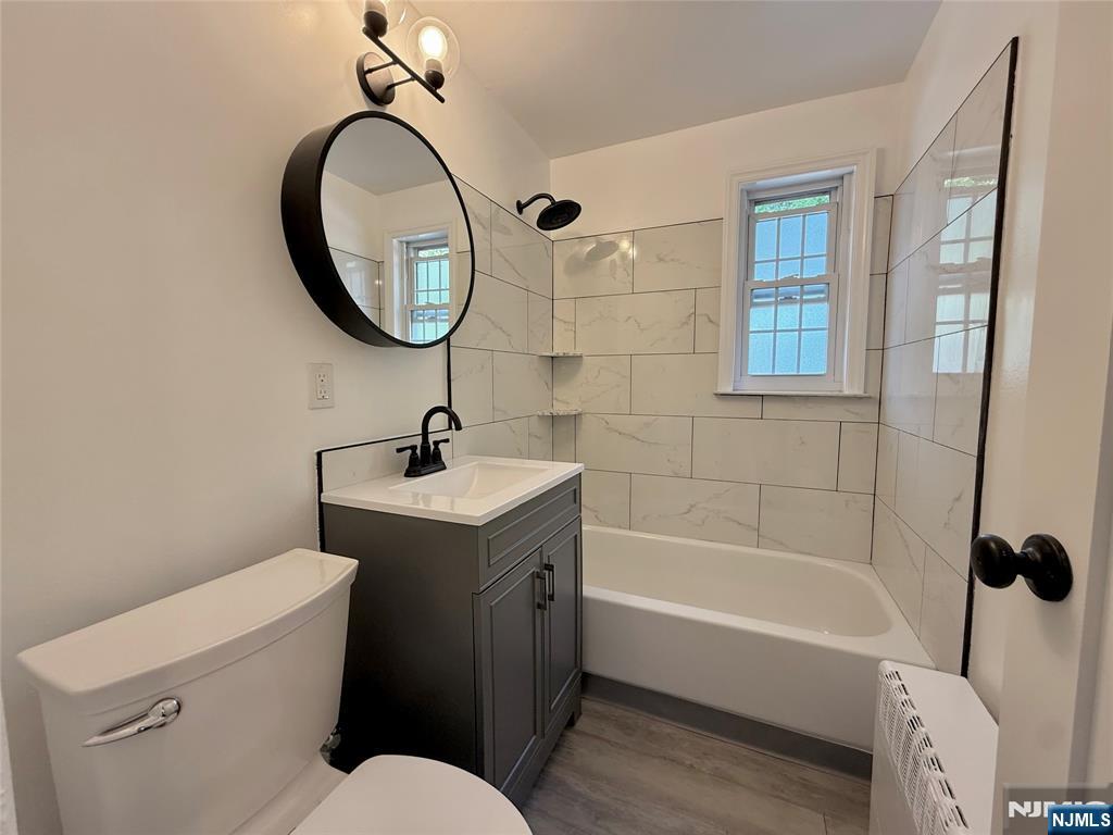 20 Clark Court Rutherford, NJ 07070 - Photo 16 of 29 a bathroom with a sink a toilet and a mirror
